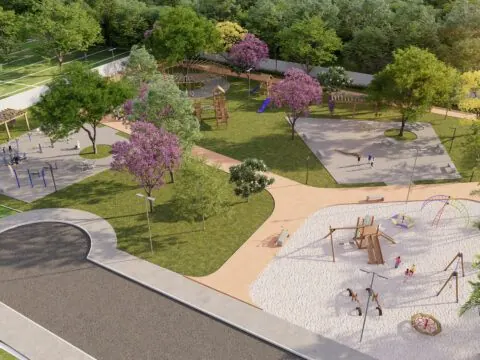 Parque do Lacus Residence com playground e árvores floridas
